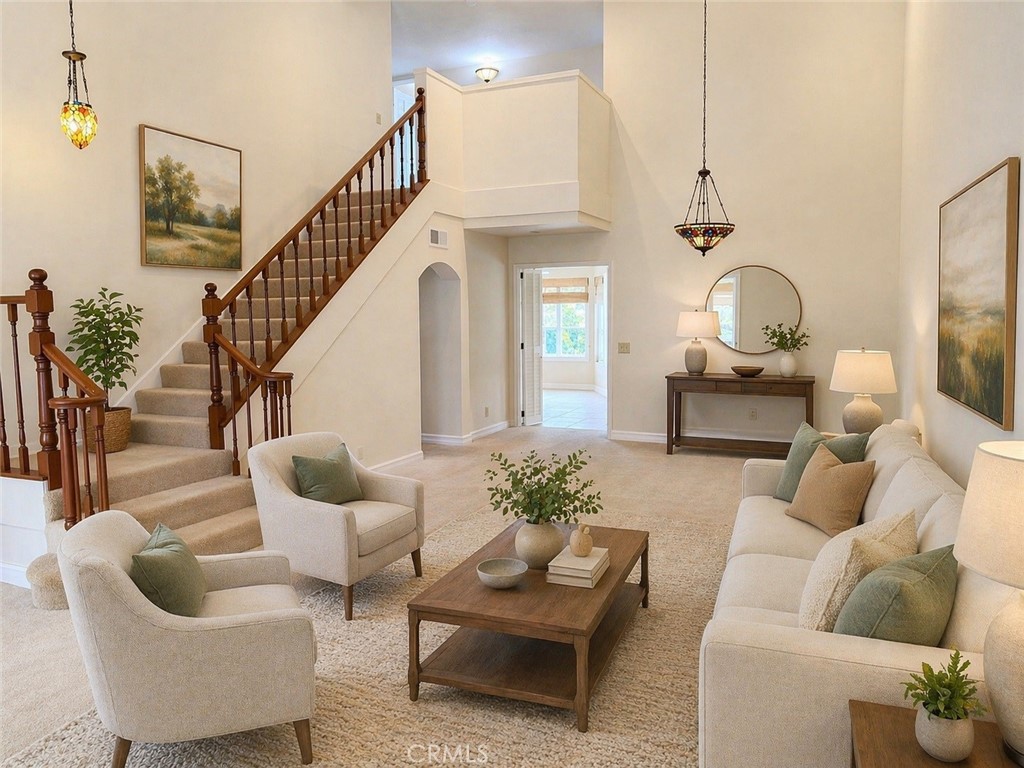 117 East Yale Loop, Unit 24 Irvine, CA 92604 - Photo 2 of 13 a living room with furniture and a potted plant