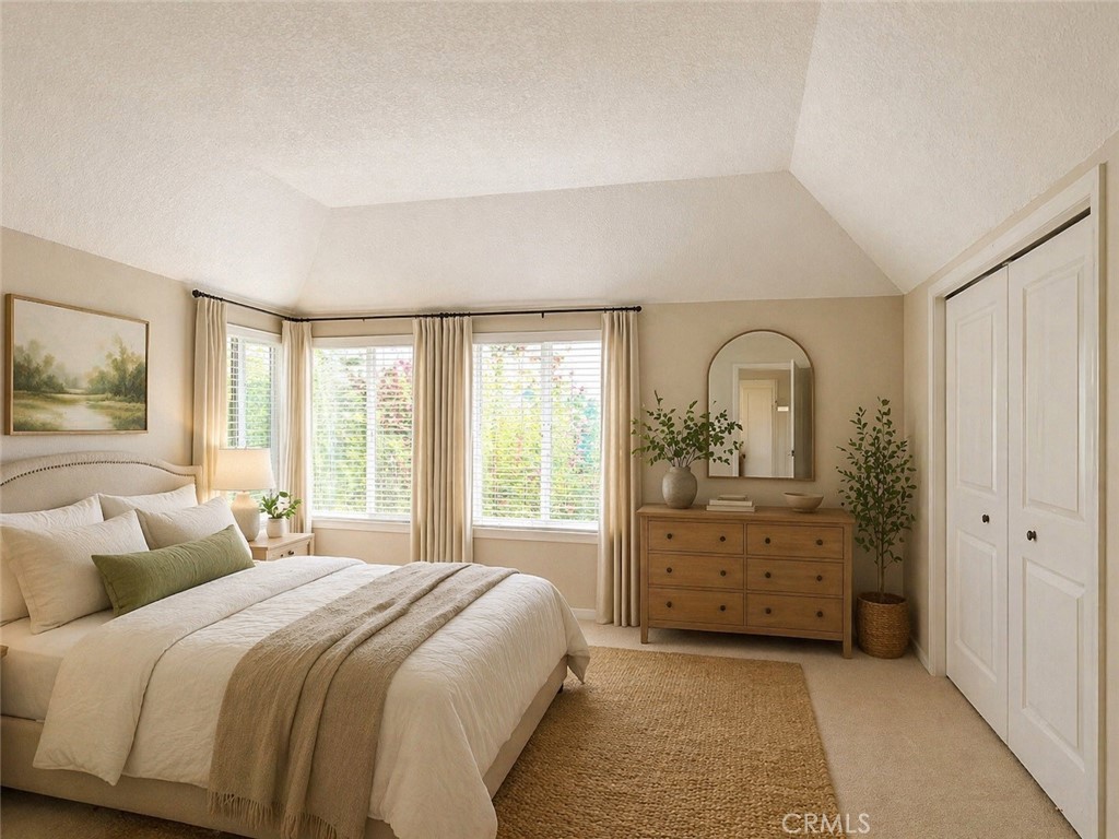 117 East Yale Loop, Unit 24 Irvine, CA 92604 - Photo 6 of 13 a bedroom with a bed and a dresser