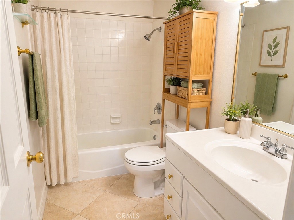 117 East Yale Loop, Unit 24 Irvine, CA 92604 - Photo 8 of 13 a bathroom with a sink toilet and shower