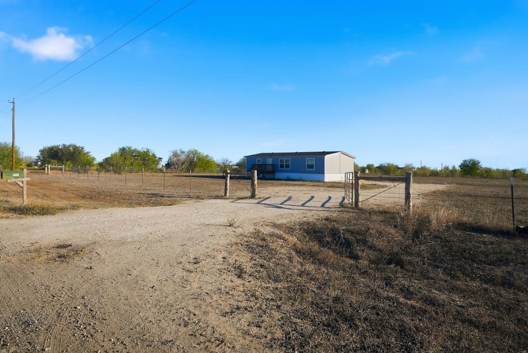 553 Jennifer Loop Orange Grove, TX 78372 - Photo 2 of 30 a view of a lake with a yard