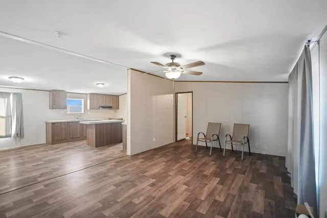 a view of kitchen with furniture and wooden floor