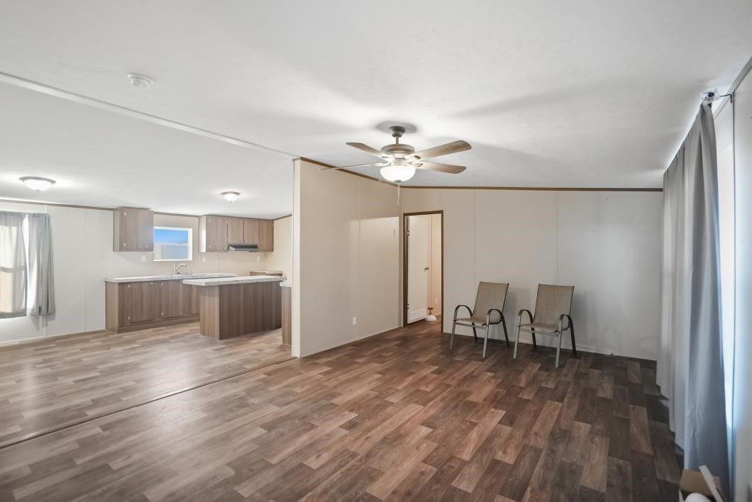 553 Jennifer Loop Orange Grove, TX 78372 - Photo 7 of 30 a view of kitchen with furniture and wooden floor
