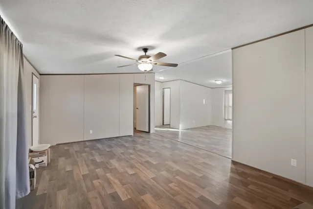 a view of an empty room with a window