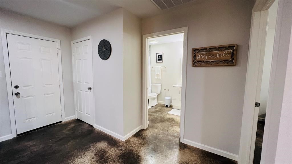 635 Martin Luther King Road Ames, TX 77575 - Photo 11 of 20 a view of a hallway with wooden floor