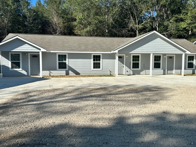 635 Martin Luther King Road Ames, TX 77575 - Photo 3 of 20 a front view of a house with a yard