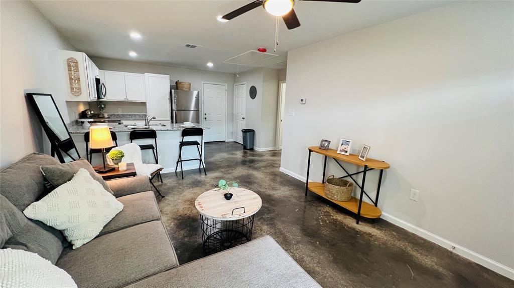 635 Martin Luther King Road Ames, TX 77575 - Photo 4 of 20 a living room with furniture and kitchen view