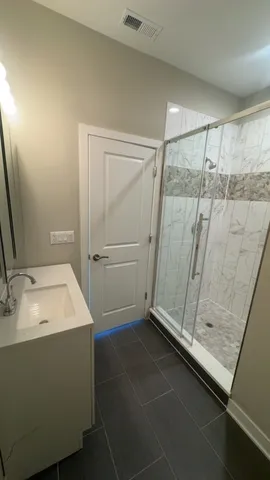a bathroom with a sink and a mirror