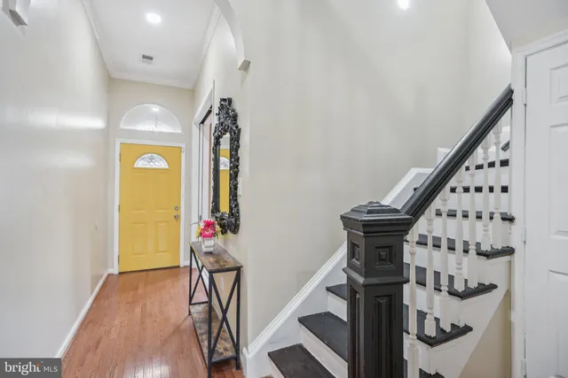 a view of an entryway with wooden floor