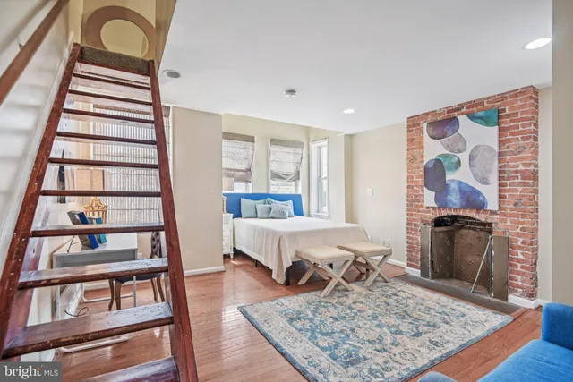 a living room with furniture and a rug