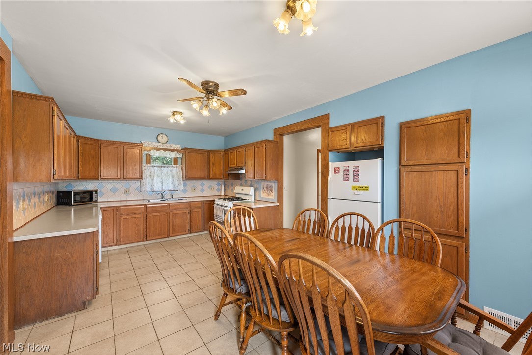 9990 Broadview Road Broadview Heights, OH 44147 - Photo 18 of 47 Dining room with ceiling fan and light tile patterned floors