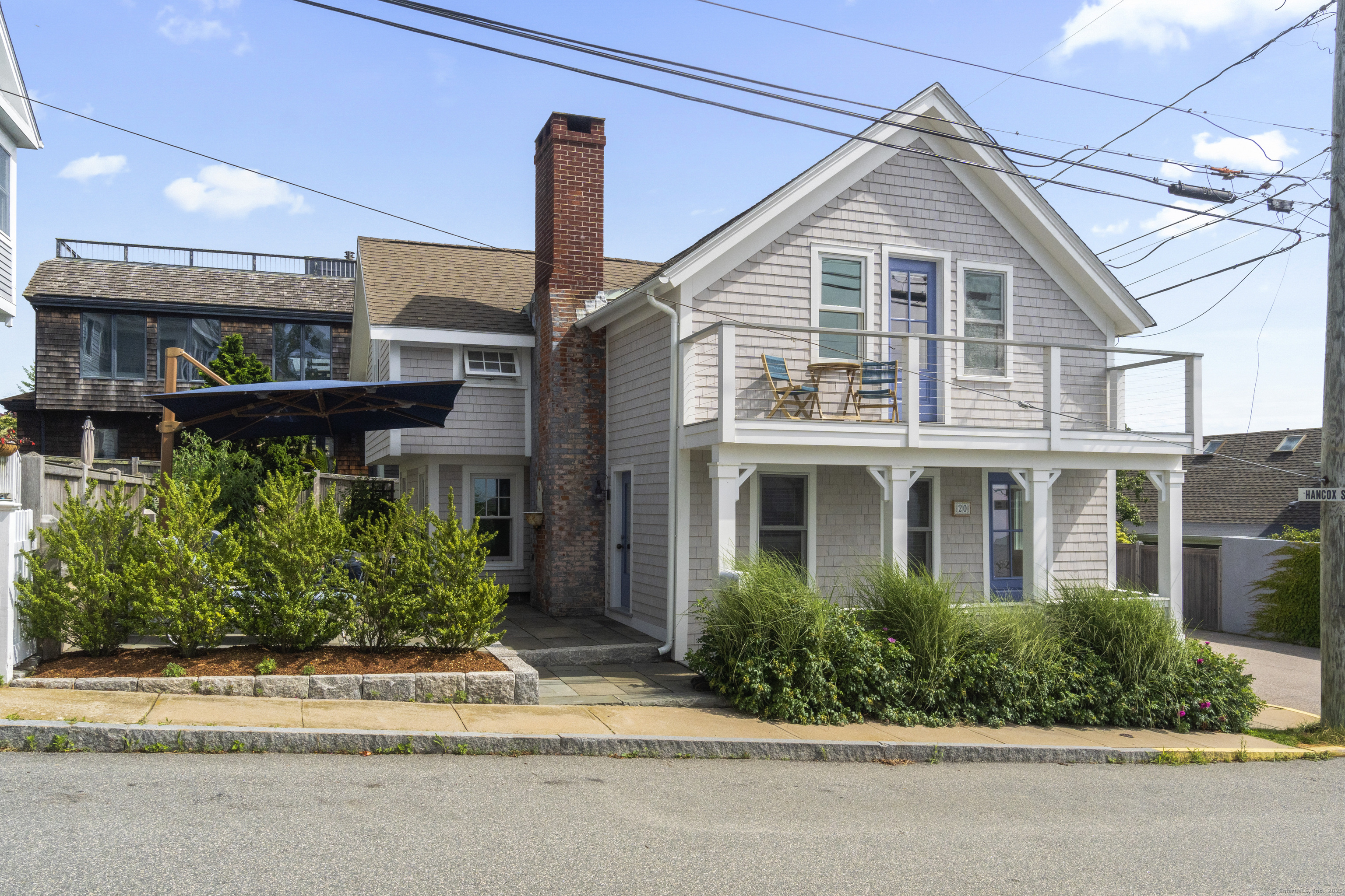 20 Omega Street Stonington, CT 06378 - Photo 2 of 37 a front view of a house with a yard