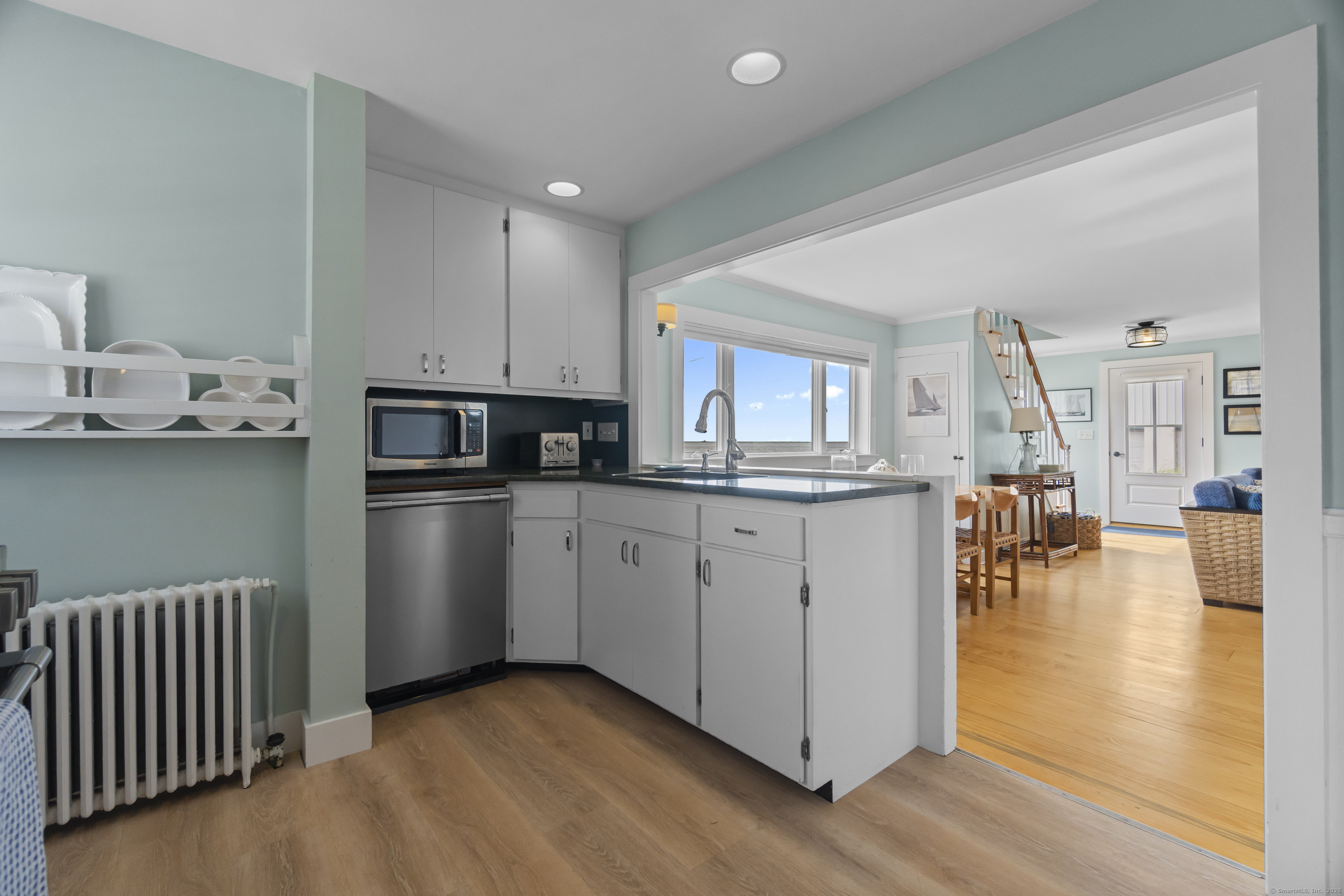 20 Omega Street Stonington, CT 06378 - Photo 21 of 37 a kitchen with cabinets and chairs