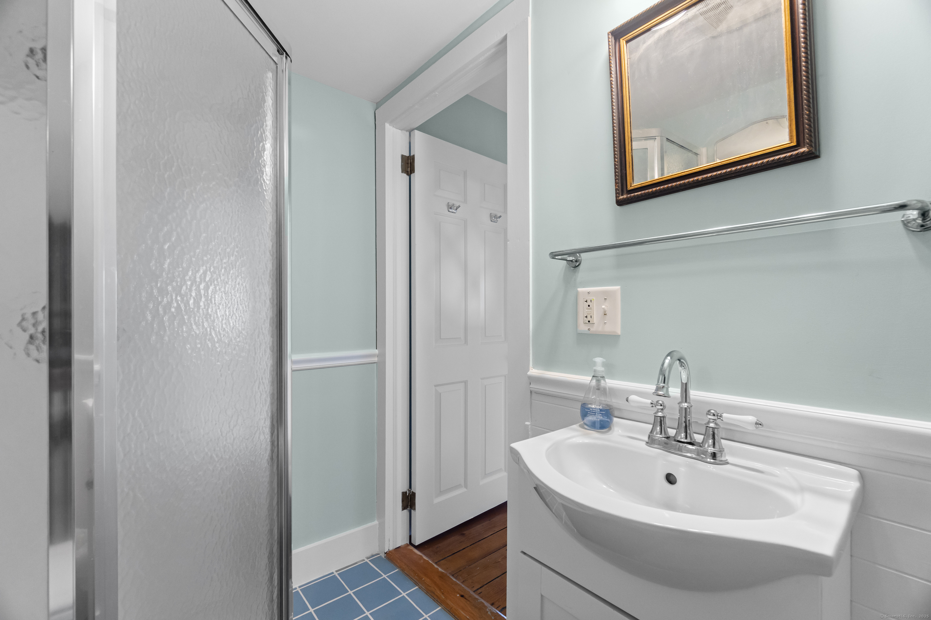 20 Omega Street Stonington, CT 06378 - Photo 23 of 37 a bathroom with a sink and mirror