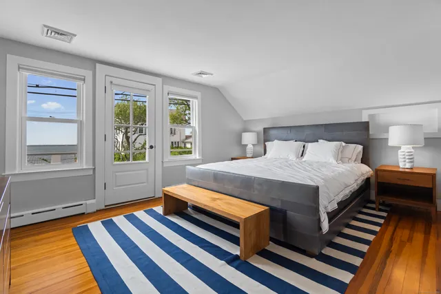 a bed room with a bed and a night stand