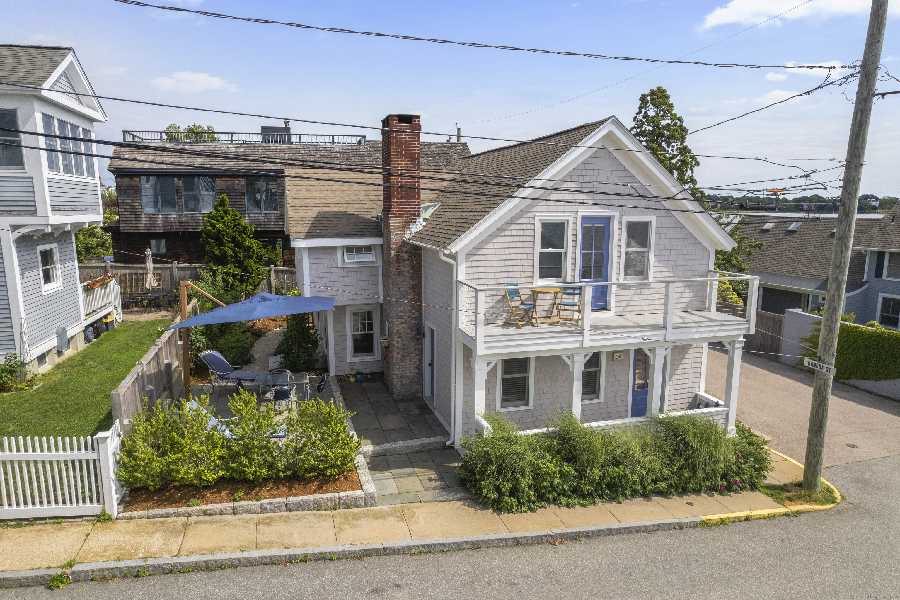 20 Omega Street Stonington, CT 06378 - Photo 3 of 37 a front view of a house with a yard