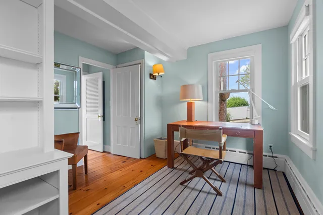 a lots of flowers in front of a house