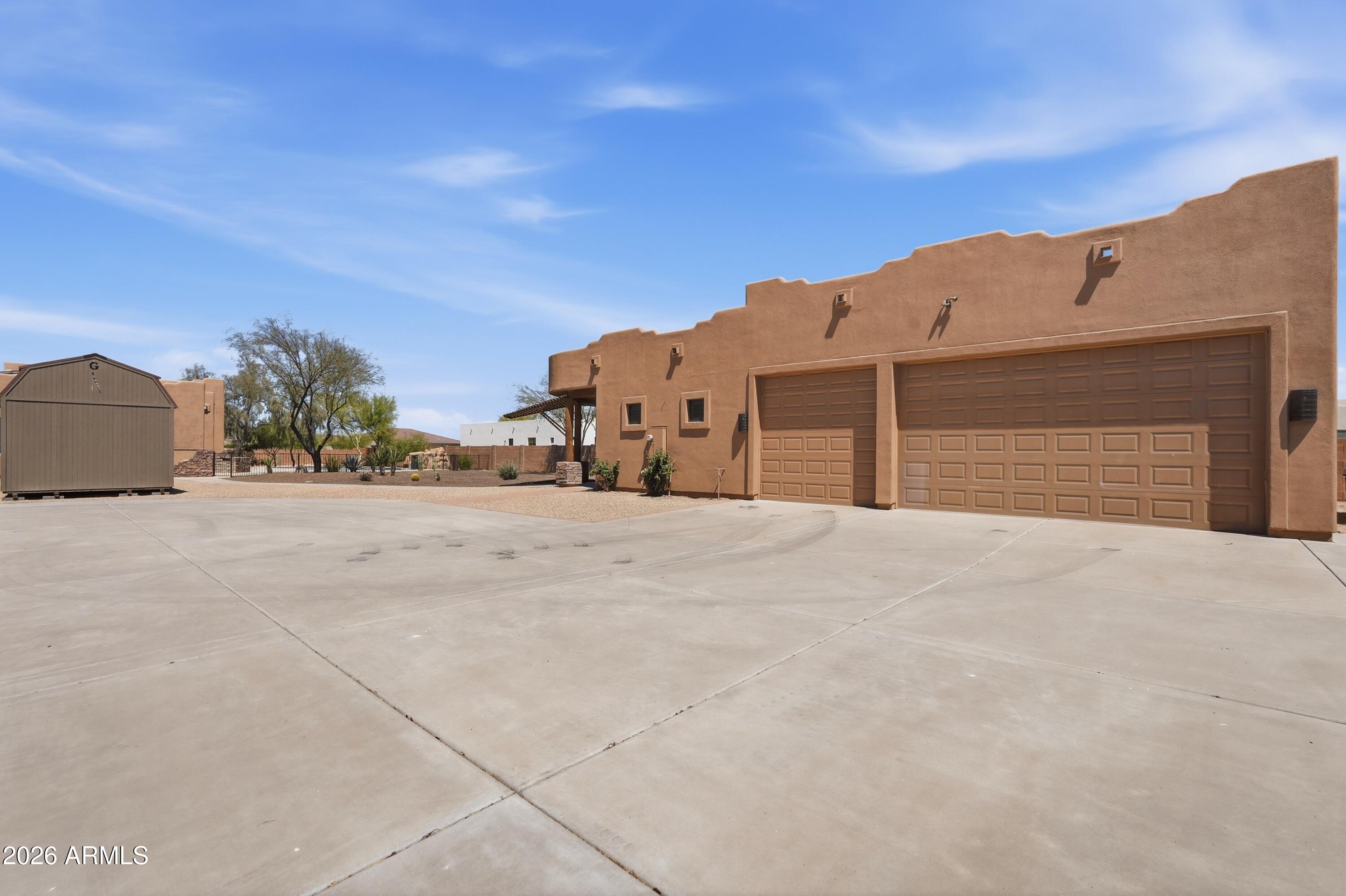 2616 West Canyon Road Phoenix, AZ 85086 - Photo 33 of 45 a view of large house with a big yard