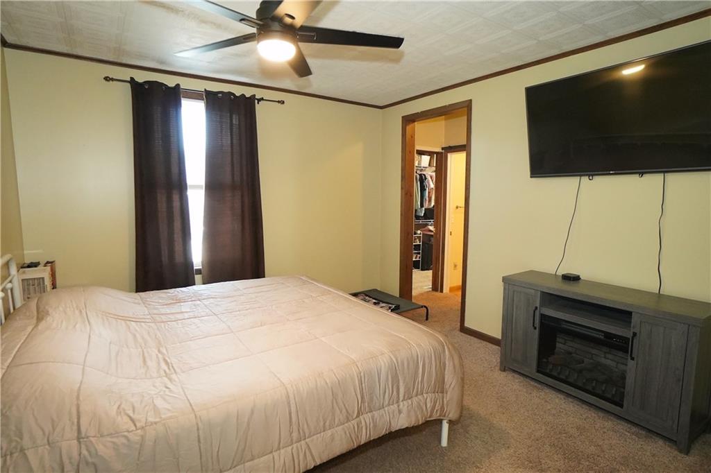 124 Hazel Street Kittanning, PA 16201 - Photo 15 of 26 a bedroom with a bed and a flat screen tv