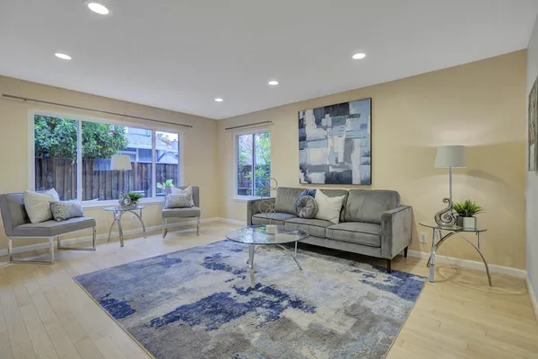a living room with furniture and a large window