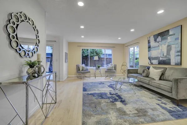 a living room with furniture and a large window