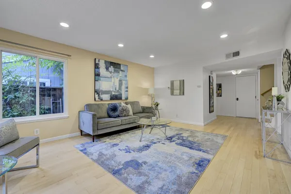 a living room with furniture and a large window
