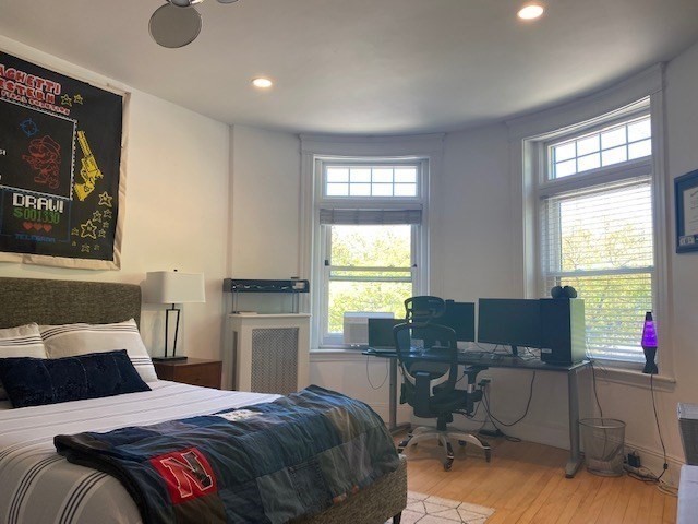 1793 Beacon Street, Unit 3 Brookline, MA 02445 - Photo 14 of 25 a bedroom with a bed and furniture