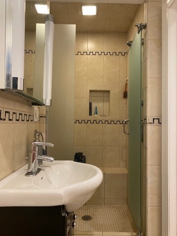 1793 Beacon Street, Unit 3 Brookline, MA 02445 - Photo 18 of 25 a bathroom with a sink a toilet and shower