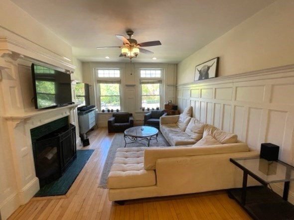 1793 Beacon Street, Unit 3 Brookline, MA 02445 - Photo 3 of 25 a living room with furniture and a flat screen tv