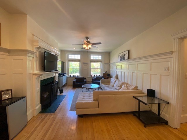 1793 Beacon Street, Unit 3 Brookline, MA 02445 - Photo 4 of 25 a living room with furniture and a flat screen tv
