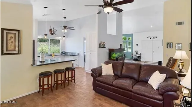 a living room with furniture and a large window