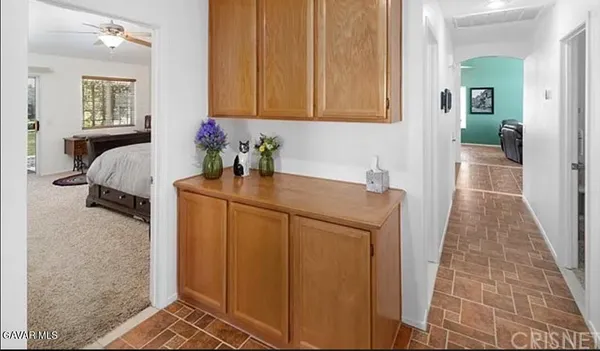 a room that has a sink and a chair in it