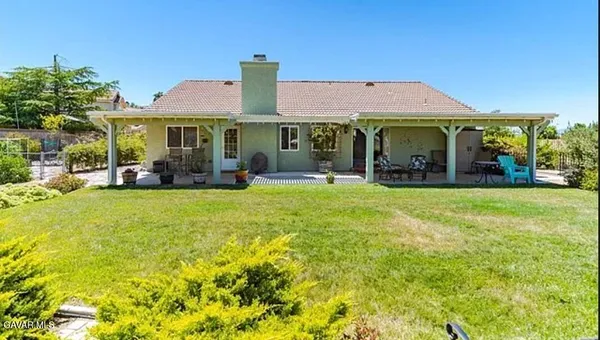 a view of a big yard with front of house