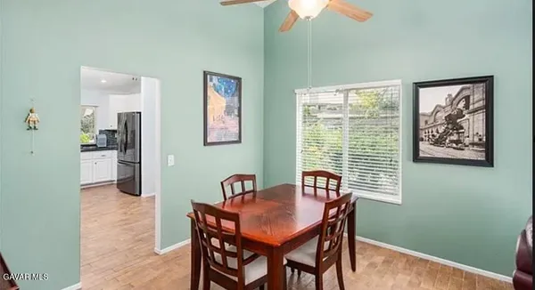 a dining room with furniture and window