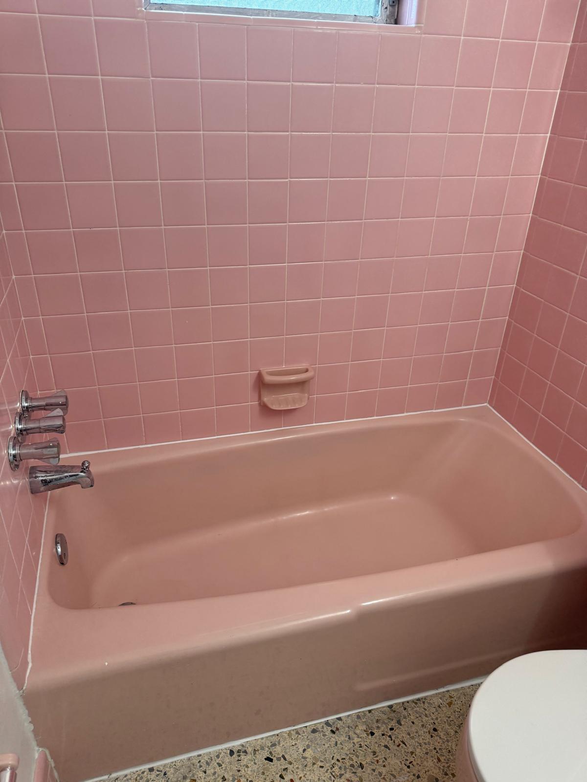 126 Cleveland Street, Unit 7 Lake Worth Beach, FL 33461 - Photo 14 of 24 a bathroom with a bathtub and toilet