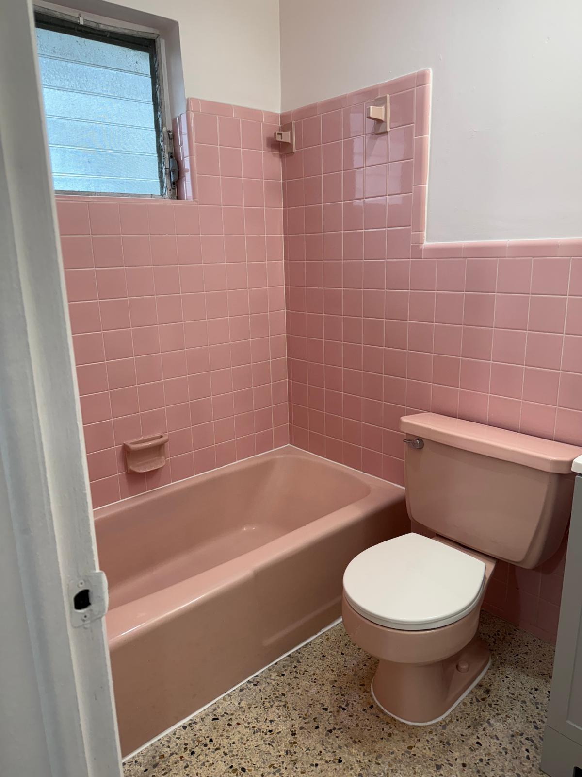 126 Cleveland Street, Unit 7 Lake Worth Beach, FL 33461 - Photo 16 of 24 a bathroom with a toilet and a bath tub