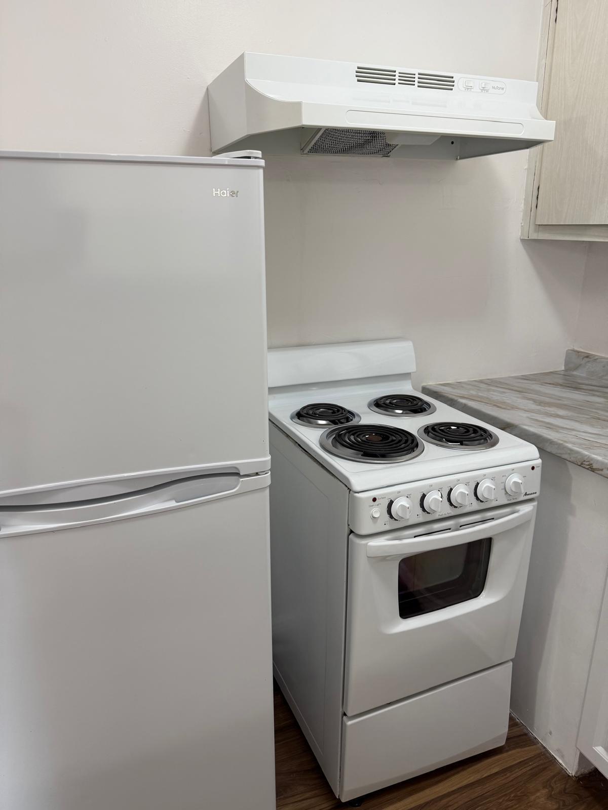 126 Cleveland Street, Unit 7 Lake Worth Beach, FL 33461 - Photo 6 of 24 a close view of washer and dryer