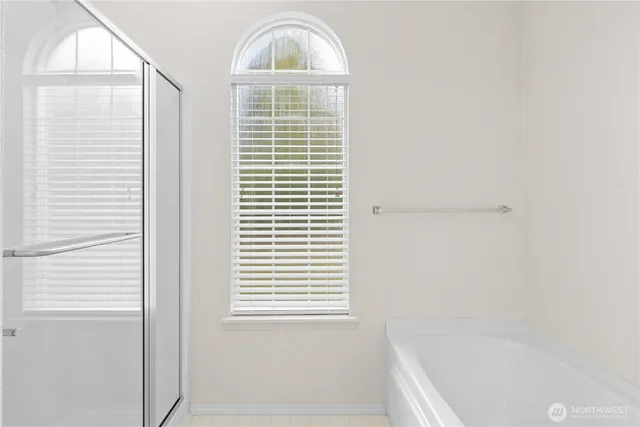 a bathroom with a window sink and vanity