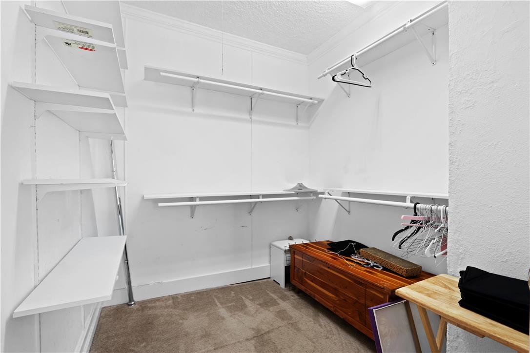 431 Pierce Street Bethlehem, PA 18015 - Photo 15 of 27 A well-organized primary closet offers ample storage with built-in shelving and clothing rods.