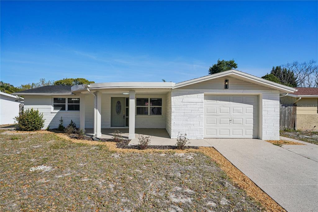 5753 10th Avenue New Port Richey, FL 34652 - Photo 1 of 46 front view of a house with a outdoor space