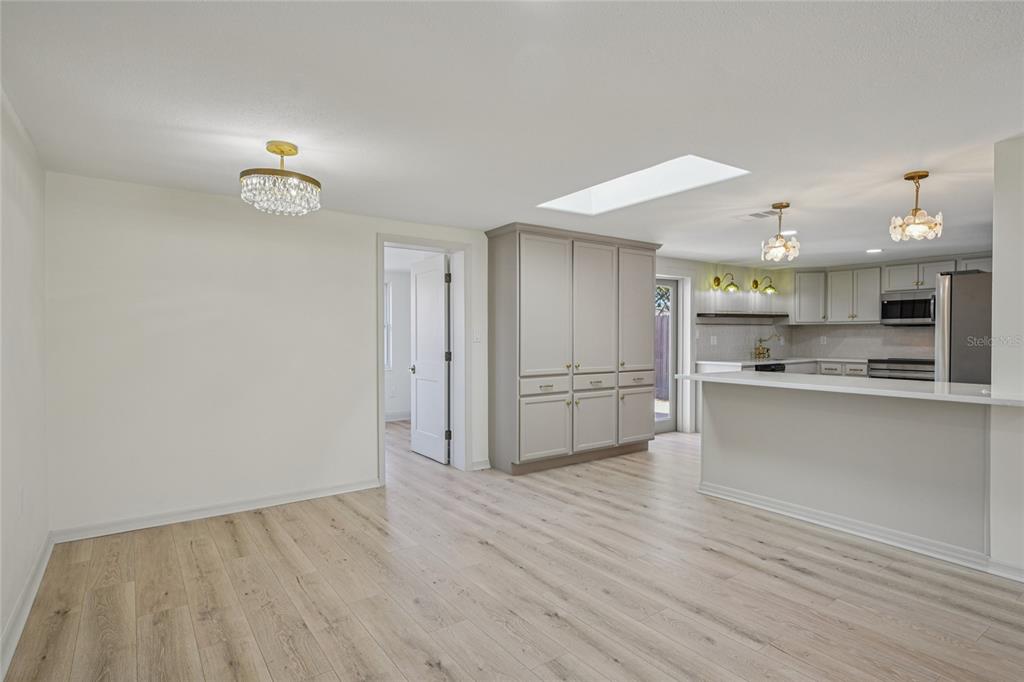 5753 10th Avenue New Port Richey, FL 34652 - Photo 12 of 46 a view of kitchen with wooden floor and electronic appliances