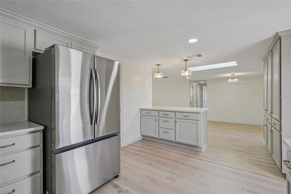 5753 10th Avenue New Port Richey, FL 34652 - Photo 19 of 46 a kitchen with a refrigerator and a sink