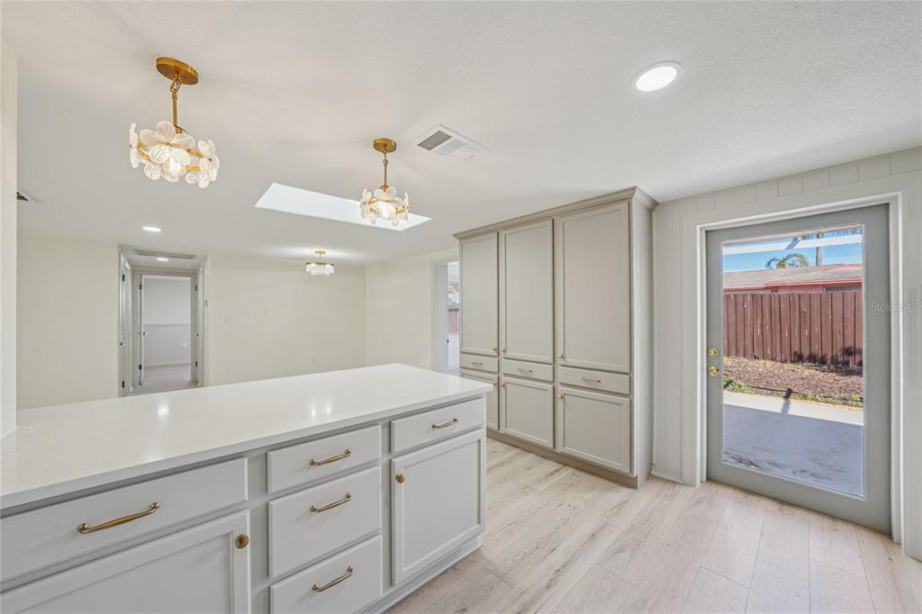 5753 10th Avenue New Port Richey, FL 34652 - Photo 20 of 46 a spacious bathroom with a granite countertop sink a mirror and shower
