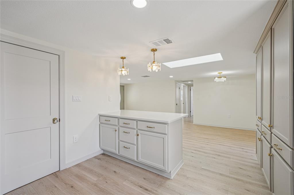 5753 10th Avenue New Port Richey, FL 34652 - Photo 21 of 46 a spacious bathroom with a granite countertop sink a mirror and a shower