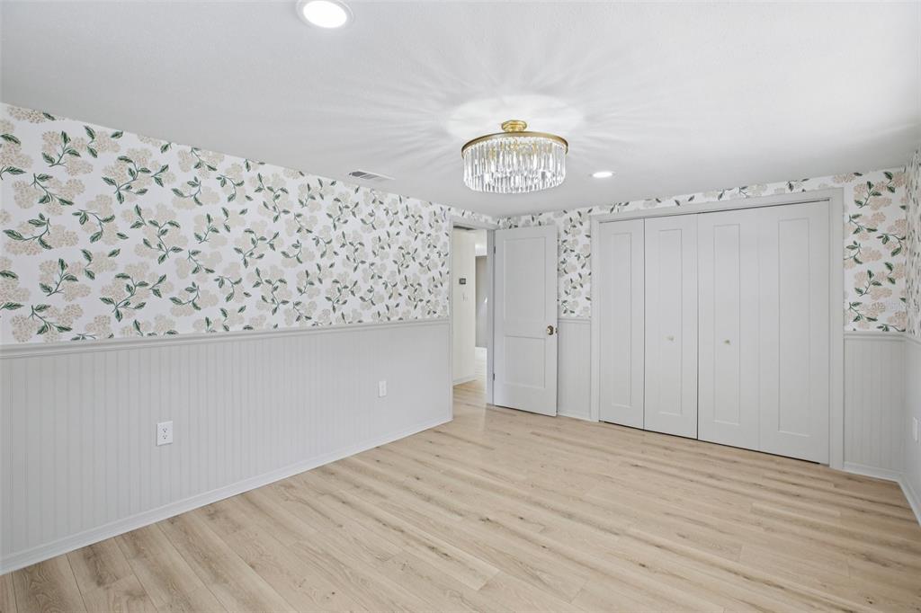 5753 10th Avenue New Port Richey, FL 34652 - Photo 24 of 46 a view of a hallway with wooden floor