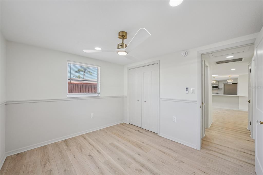 5753 10th Avenue New Port Richey, FL 34652 - Photo 30 of 46 a view of a room with wooden floor and bathroom