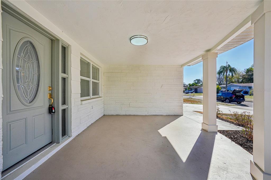 5753 10th Avenue New Port Richey, FL 34652 - Photo 4 of 46 a view of a hallway with bathroom and front door