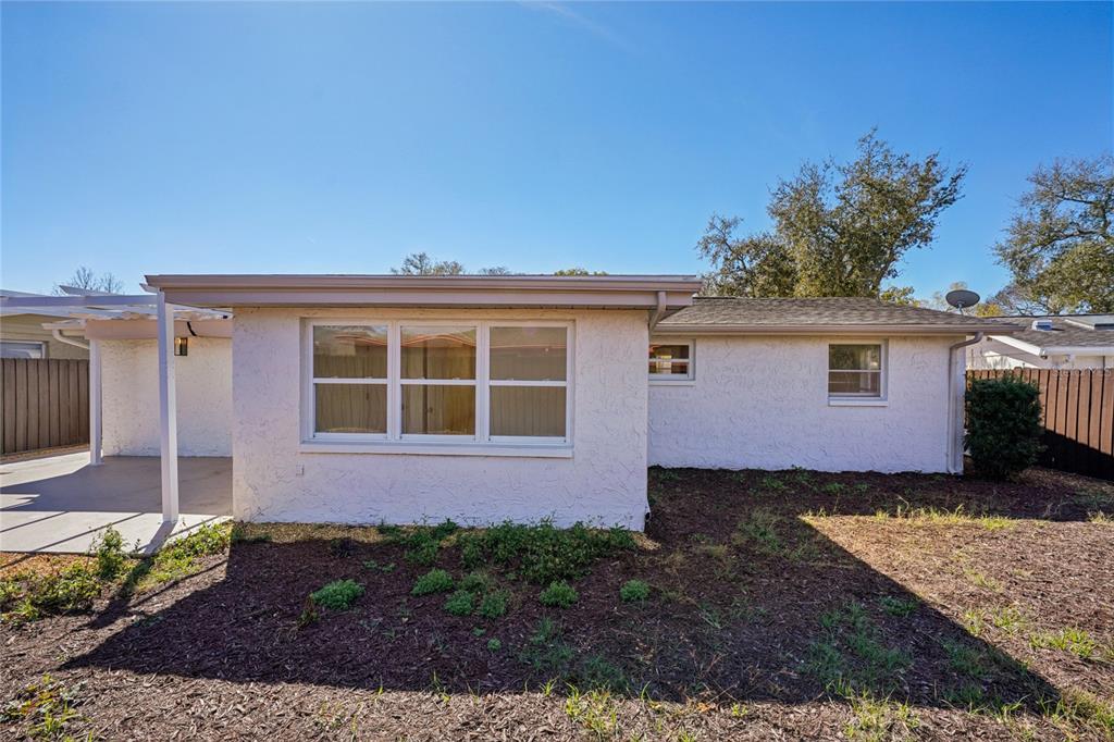 5753 10th Avenue New Port Richey, FL 34652 - Photo 43 of 46 a front view of a house with a yard