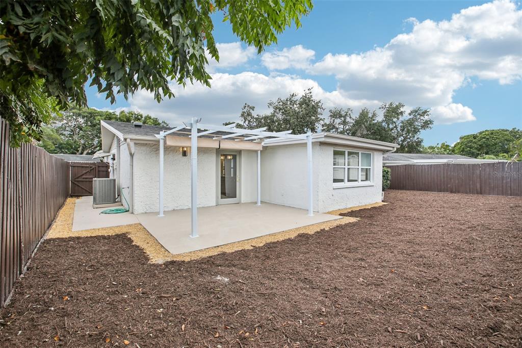 5753 10th Avenue New Port Richey, FL 34652 - Photo 44 of 46 a view of a house with a backyard