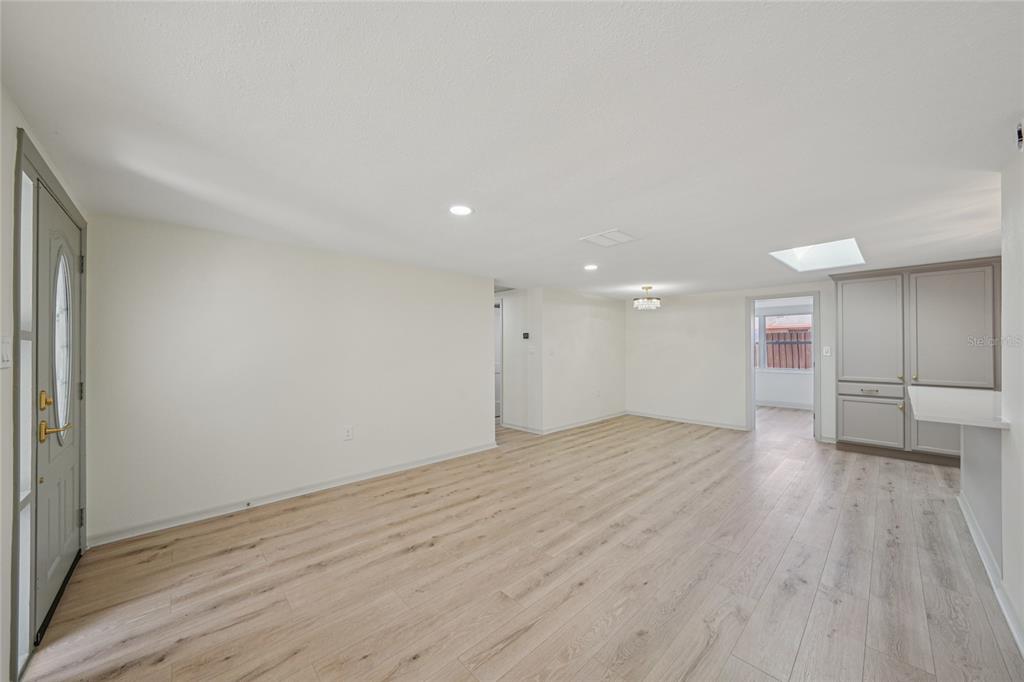 5753 10th Avenue New Port Richey, FL 34652 - Photo 8 of 46 a view of an empty room with wooden floor