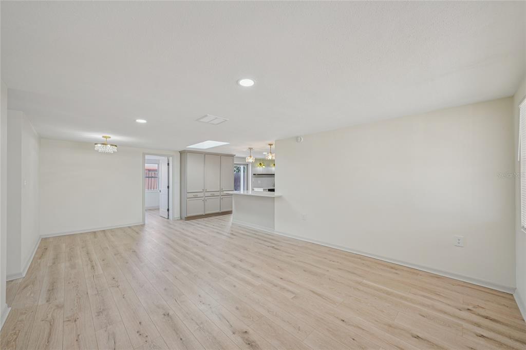 5753 10th Avenue New Port Richey, FL 34652 - Photo 10 of 46 a view of an empty room with wooden floor